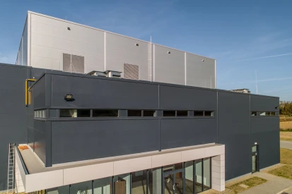 PIONART - <a href="https://www.promus.com.pl/en/offer/general-contracting/design-and-construction-steel-halls">Warehouse hall</a>, galvanizing plant hall with social and office facilities