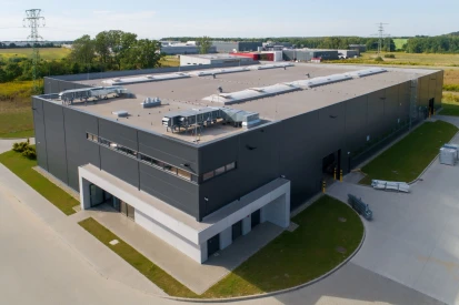 PIONART - <a href="https://www.promus.com.pl/en/offer/general-contracting/design-and-construction-steel-halls">Warehouse hall</a>, galvanizing plant hall with social and office facilities