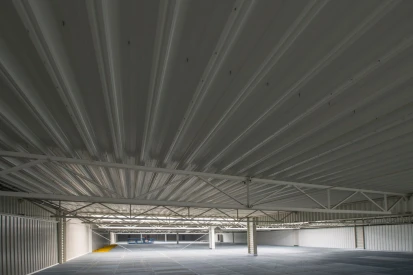 Polcar - Four-storey <a href="https://www.promus.com.pl/en/offer/general-contracting/design-and-construction-steel-halls">warehouse hall</a>